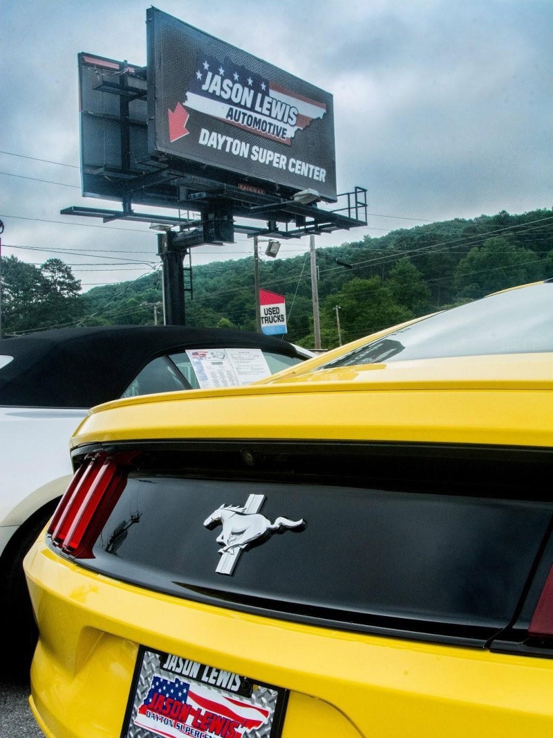 The back of a yellow mustang at the Jason Lewis Dayton Supercenter